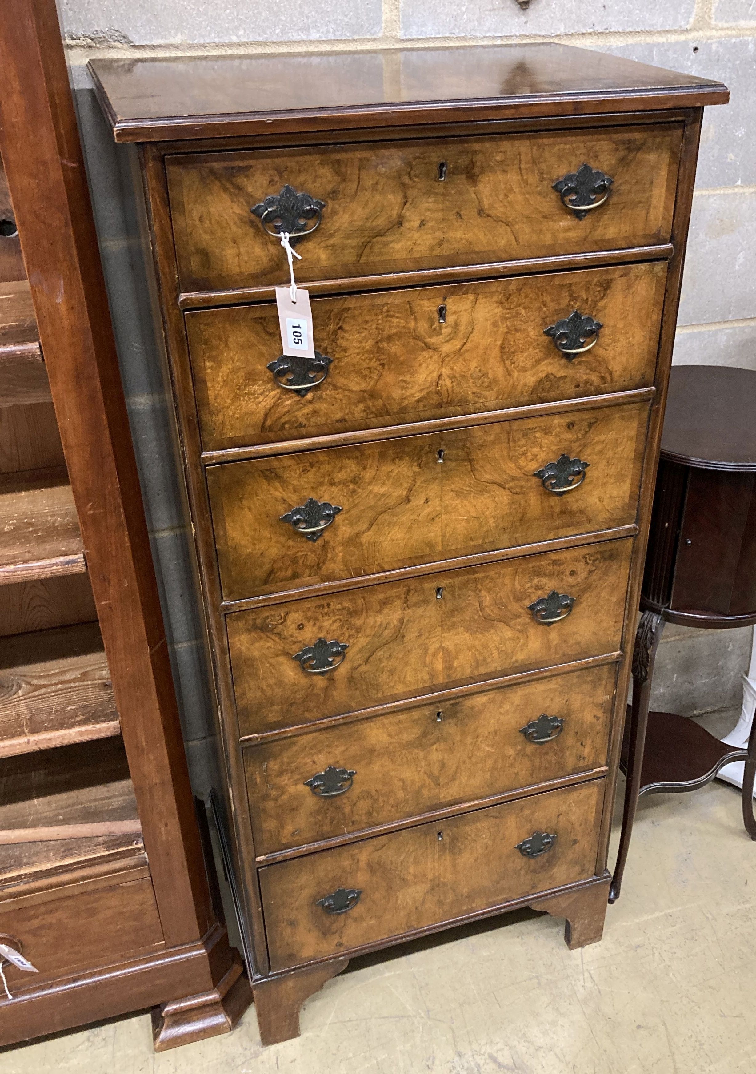 An early 20th century Queen Anne revival walnut narrow six drawer chest, width 61cm, depth 42cm, height 136cm